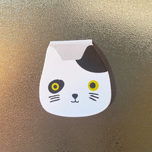 Buchzeichen mit Katzenkopf-Motiv